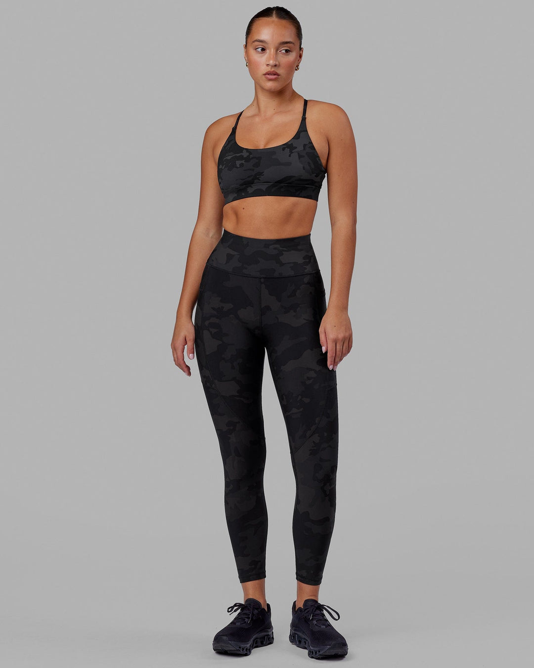 Woman wearing Rep Ultra High-Rise 7/8 Legging Pockets - Black Camo | Model:Milly | Size:S