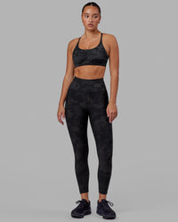 Woman wearing Rep Ultra High-Rise 7/8 Legging Pockets - Black Camo | Model:Milly | Size:S