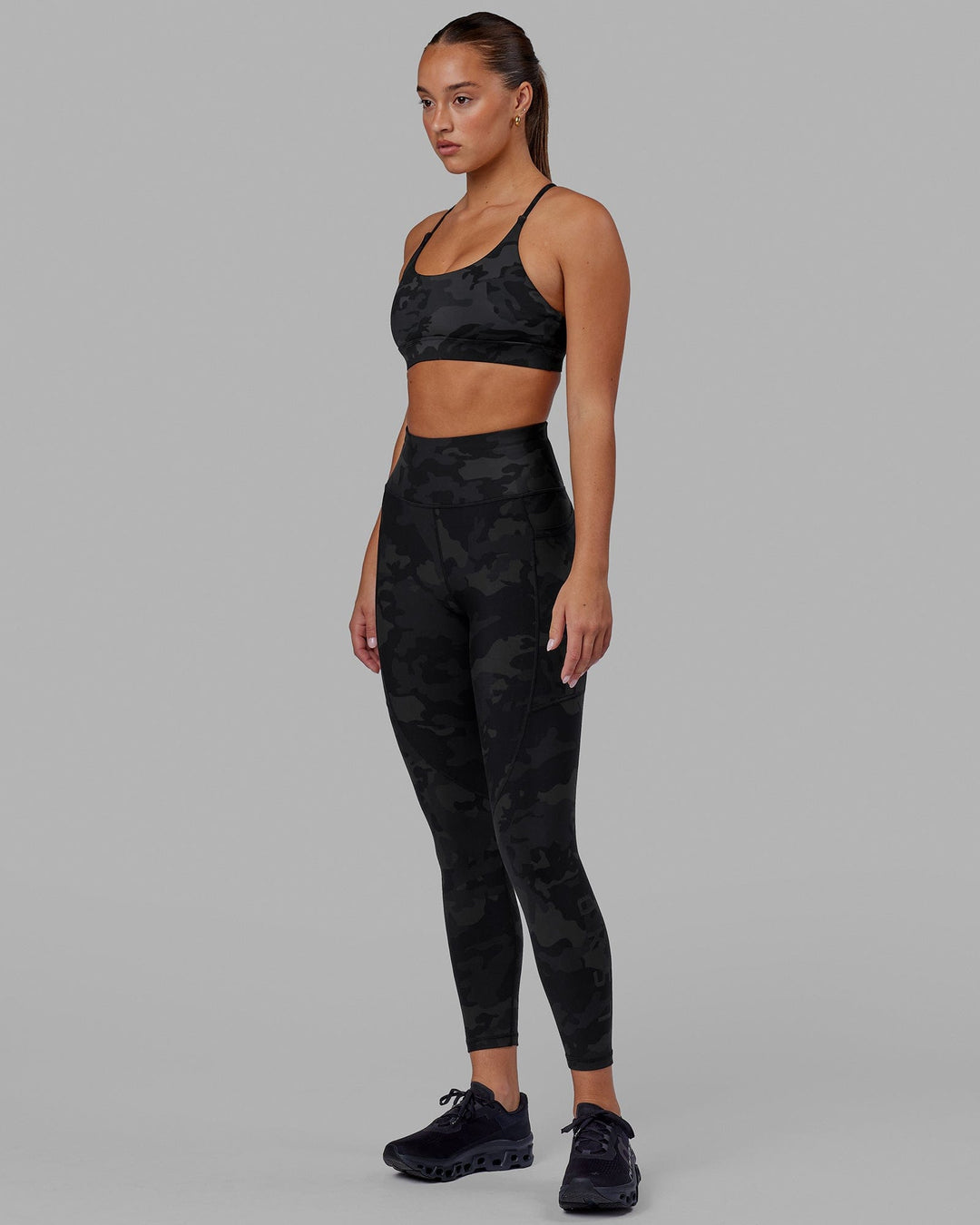 Woman wearing Rep Ultra High-Rise 7/8 Legging Pockets - Black Camo | Model:Milly | Size:S