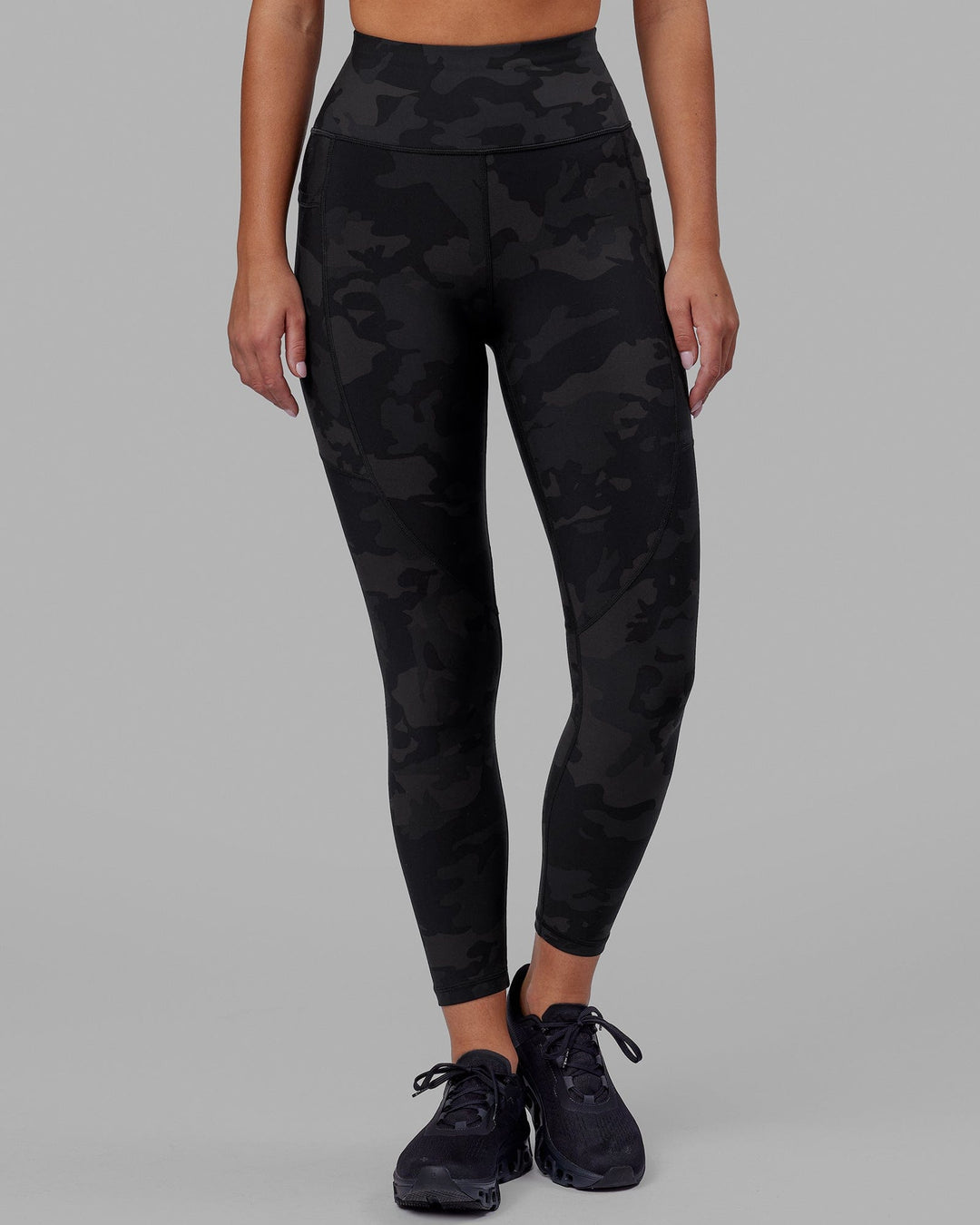 Woman wearing Rep Ultra High-Rise 7/8 Legging Pockets - Black Camo | Model:Milly | Size:S