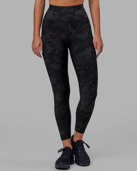 Woman wearing Rep Ultra High-Rise 7/8 Legging Pockets - Black Camo | Model:Milly | Size:S