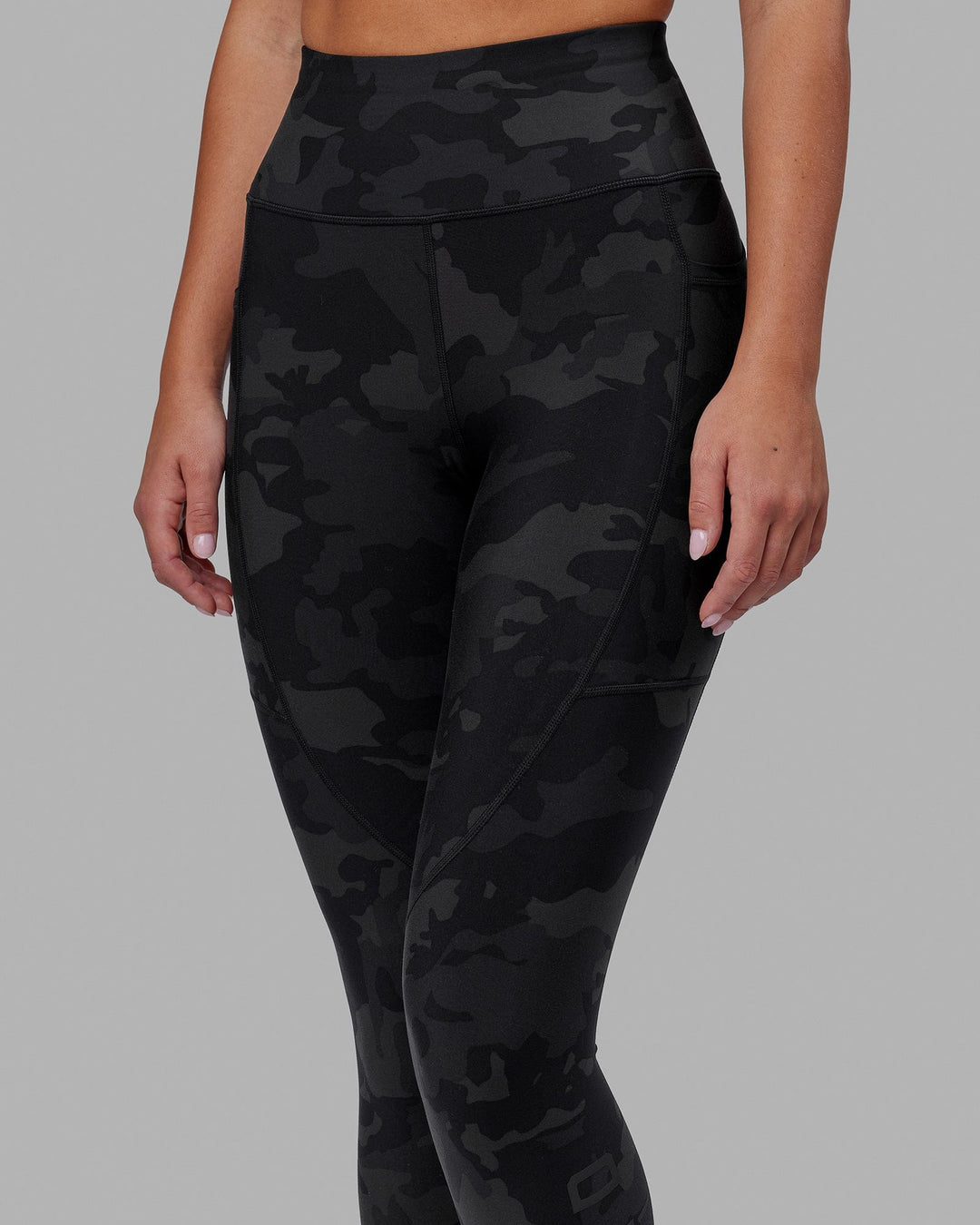 Woman wearing Rep Ultra High-Rise 7/8 Legging Pockets - Black Camo | Model:Milly | Size:S