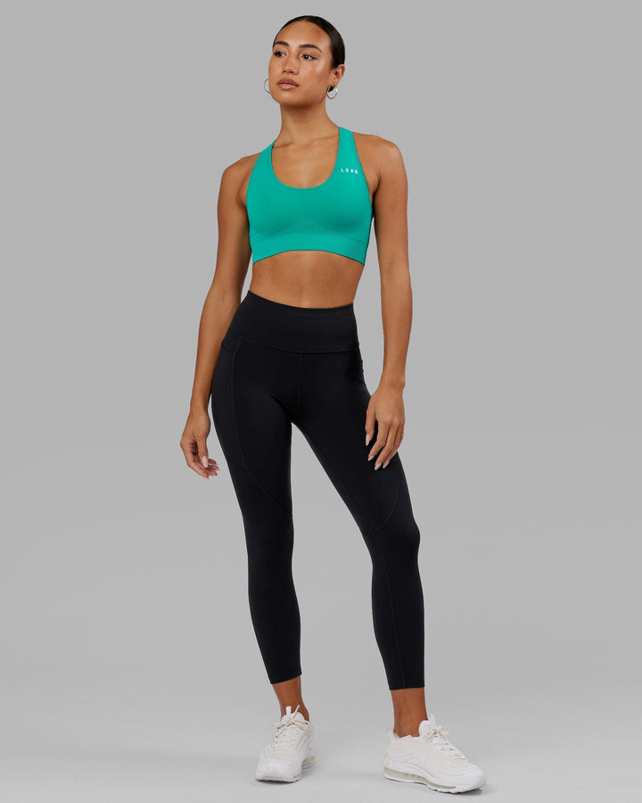 Woman wearing Rep 7/8 Length Tight - Black-Hyper Teal