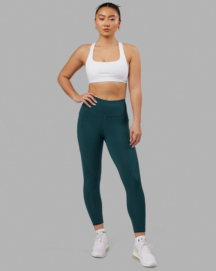 Woman wearing Rep 7/8 Length Tight - Deep Teal