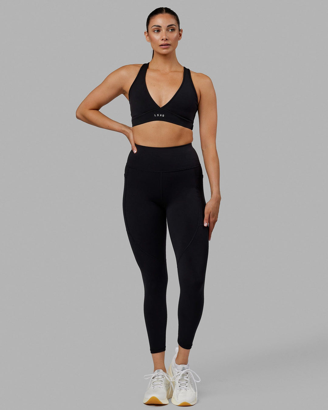 Woman wearing Rep Ultra High-Rise 7/8 Legging Pockets No Logo - Black | Model:Blaize | Size:S