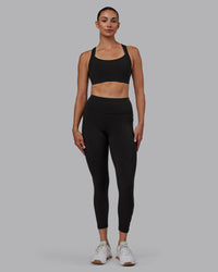 Woman wearing Rep Ultra High-Rise 7/8 Legging Pockets - Pirate Black-White | Model:Blaize | Size:S