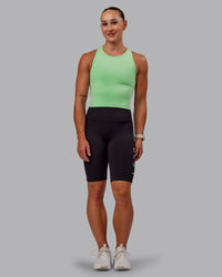 Woman wearing Rep Ultra High-Rise 9" Short Pockets - Black-Surreal Green | Model:Amber | Size:S
