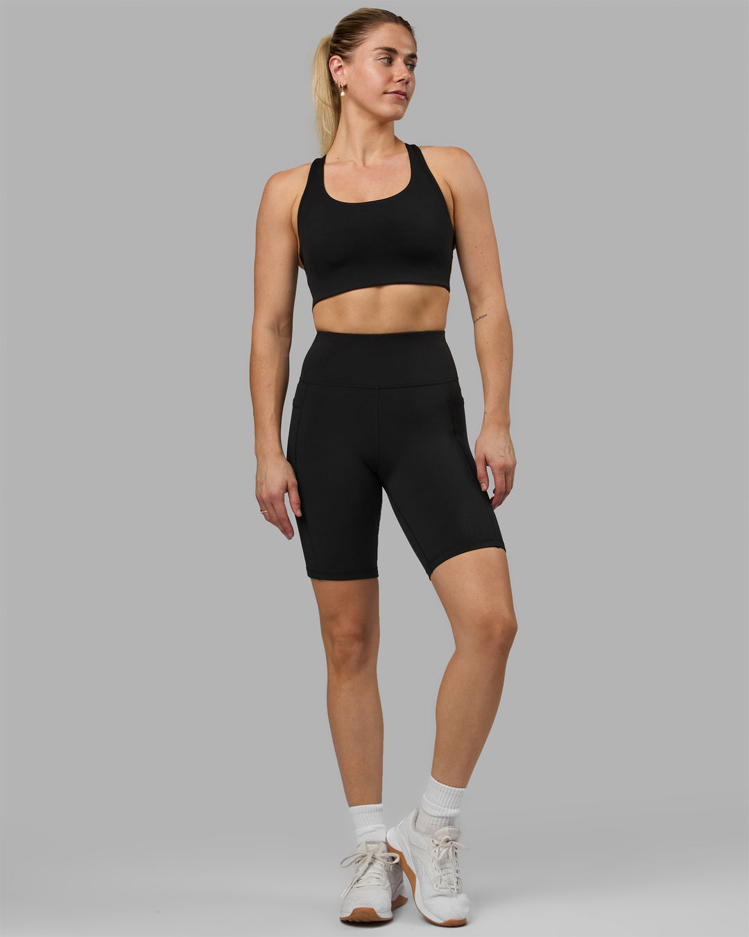 Woman wearing Rep Ultra High-Rise 9&quot; Short Pockets - Black-Black | Model:Hannah | Size:S