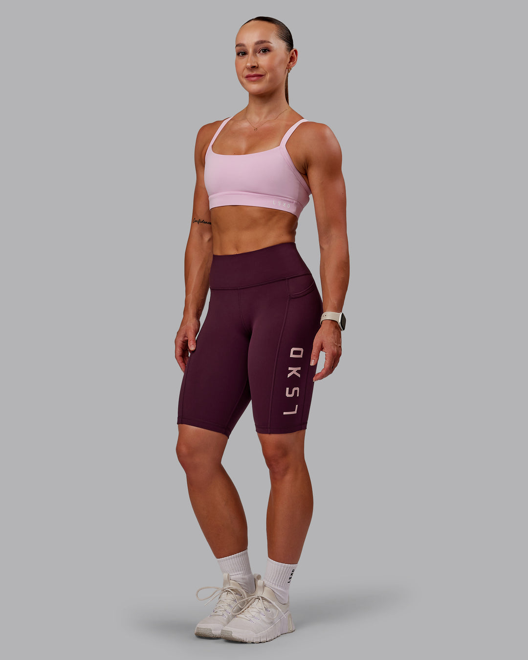 Woman wearing Rep Ultra High-Rise 9" Short Pockets - Cherry Lacquer-Marshmallow | Model:Amber | Size:S