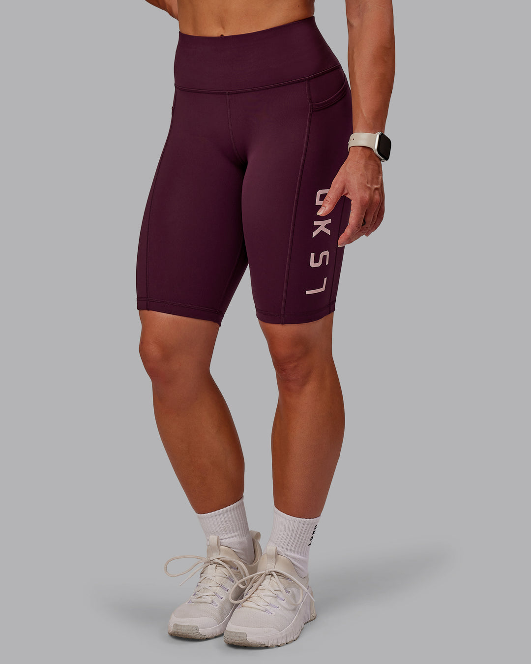 Woman wearing Rep Ultra High-Rise 9" Short Pockets - Cherry Lacquer-Marshmallow | Model:Amber | Size:S