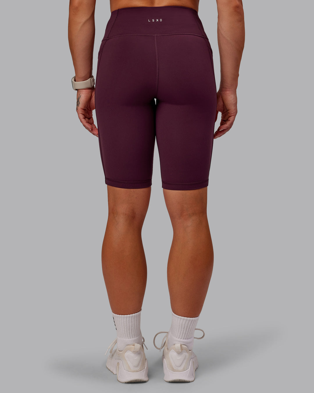 Woman wearing Rep Ultra High-Rise 9" Short Pockets - Cherry Lacquer-Marshmallow | Model:Amber | Size:S