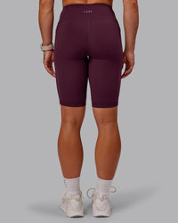 Woman wearing Rep Ultra High-Rise 9" Short Pockets - Cherry Lacquer-Marshmallow | Model:Amber | Size:S