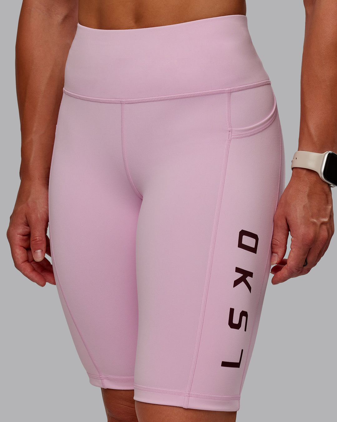 Woman wearing Rep Ultra High-Rise 9&quot; Short Pockets - Marshmallow-Cherry Lacquer | Model:Amber | Size:S