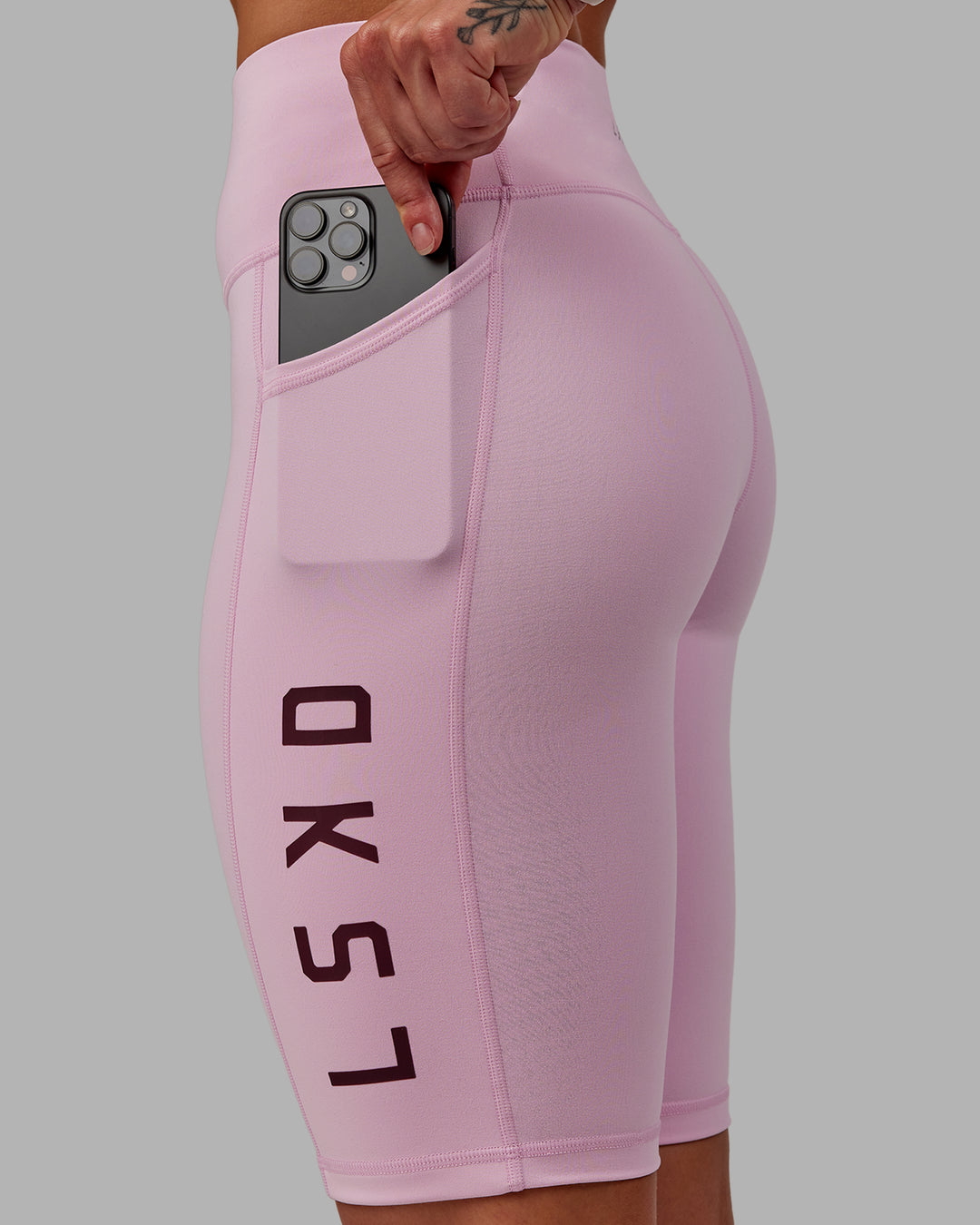 Woman wearing Rep Ultra High-Rise 9&quot; Short Pockets - Marshmallow-Cherry Lacquer | Model:Amber | Size:S