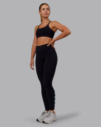 Woman wearing Rep Ultra High-Rise Full Length Legging Pockets - Black-Retro Blue | Model:Hannah | Size:S