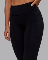 Woman wearing Rep Ultra High-Rise Full Length Legging Pockets - Black-Retro Blue | Model:Hannah | Size:S
