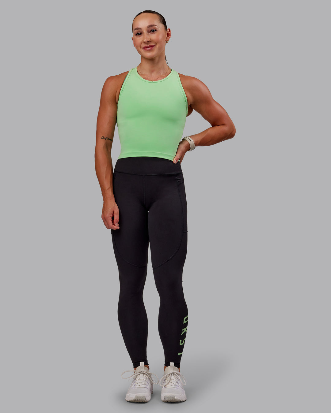 Woman wearing Rep Ultra High-Rise Full Length Legging Pockets - Black-Surreal Green | Model:Amber | Size:S