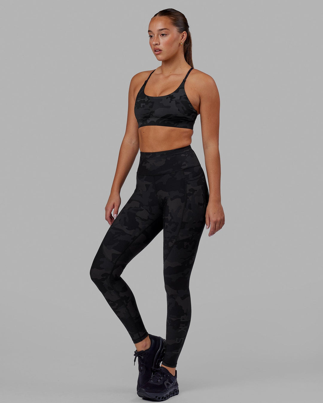 Woman wearing Rep Ultra High-Rise Full Length Legging Pockets - Black Camo | Model:Milly | Size:S