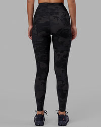 Woman wearing Rep Ultra High-Rise Full Length Legging Pockets - Black Camo | Model:Milly | Size:S