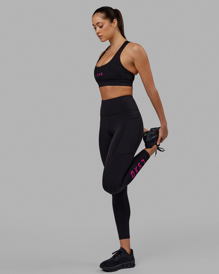 Woman wearing Rep Full Length Tight - Black-Neon Magenta