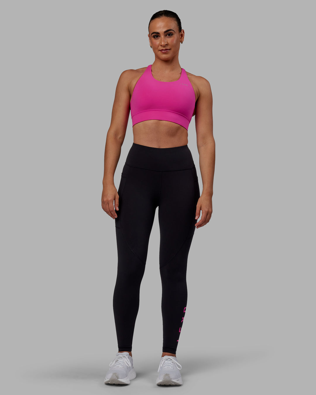 Woman wearing Rep Ultra High-Rise Full Length Legging Pockets - Black-Fuchsia Pink | Model:Sophie | Size:S