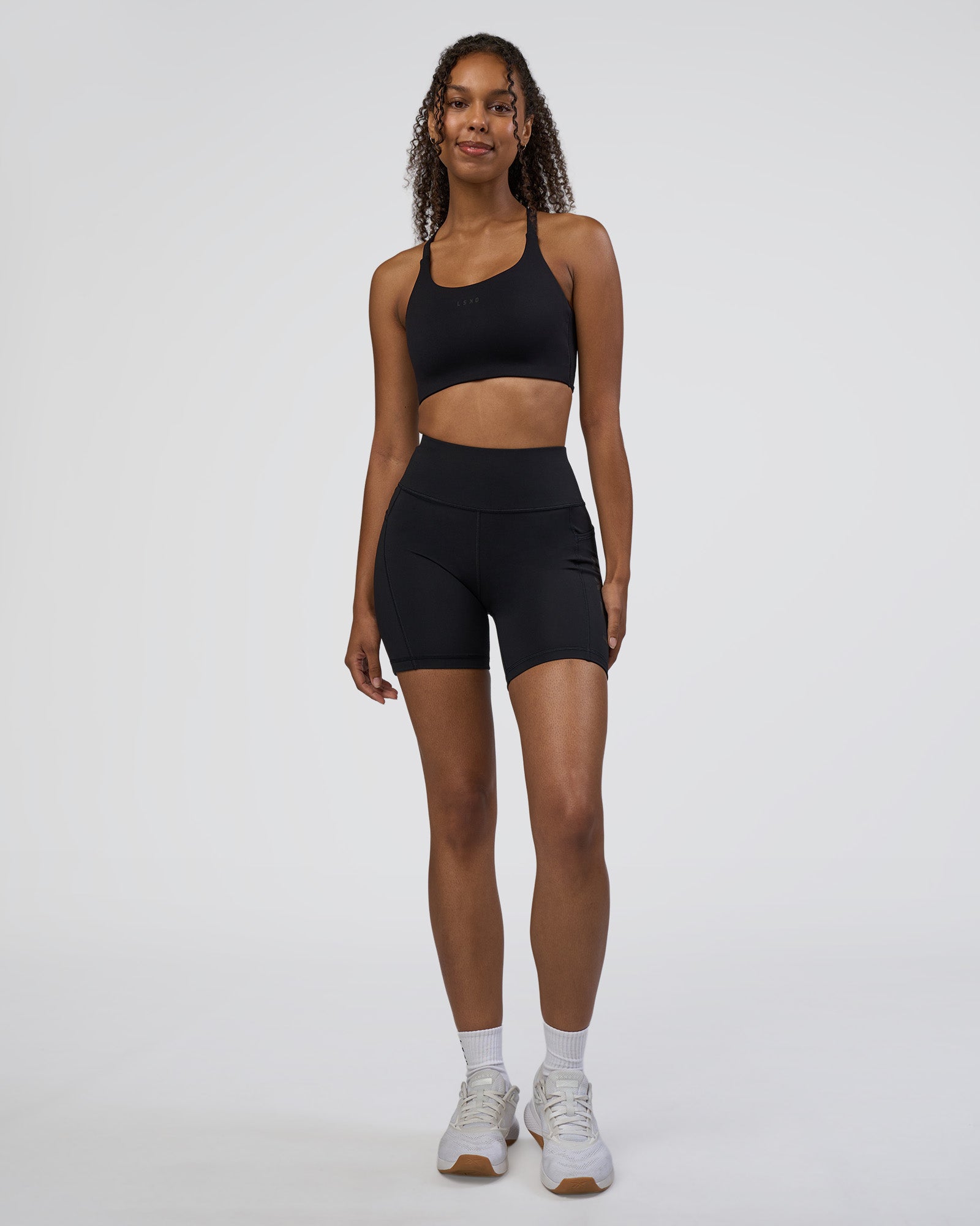 Woman wearing Rep Ultra High-Rise 6" Short Pockets - Black-Black | Model:Jordan | Size:S