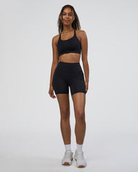 Woman wearing Rep Ultra High-Rise 6" Short Pockets - Black-Black | Model:Jordan | Size:S