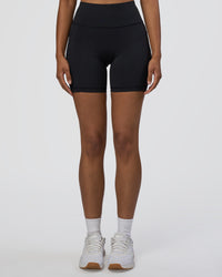 Woman wearing Rep Ultra High-Rise 6" Short Pockets - Black-Black | Model:Jordan | Size:S