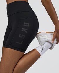 Woman wearing Rep Ultra High-Rise 6" Short Pockets - Black-Black | Model:Jordan | Size:S