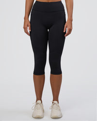 Woman wearing Rep Ultra High-Rise 3/4 Legging Pockets - Black-Black | Model:Amity | Size:S