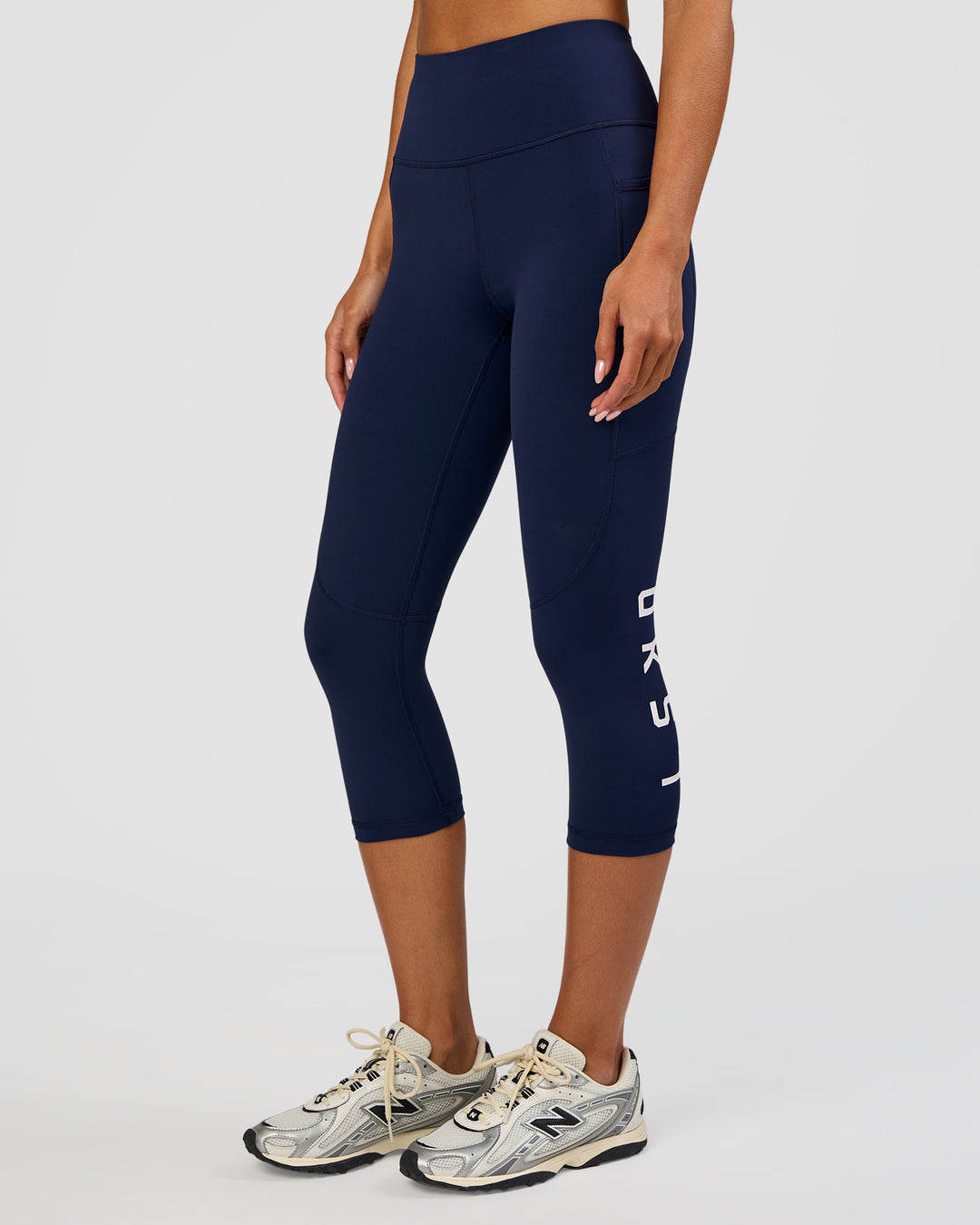 Woman wearing Rep Ultra High-Rise 3/4 Legging Pockets - Future Navy-White | Model:Dakota | Size:S