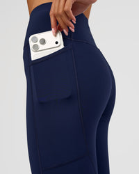 Woman wearing Rep Ultra High-Rise 3/4 Legging Pockets - Future Navy-White | Model:Dakota | Size:S