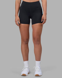 Woman wearing Rep Ultra High-Rise 4" Short Pockets - Black-Blue Atoll | Model:Sophie | Size:S