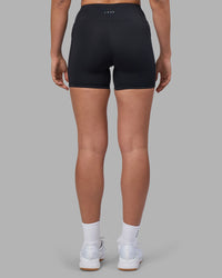 Woman wearing Rep Ultra High-Rise 4" Short Pockets - Black-Blue Atoll | Model:Sophie | Size:S