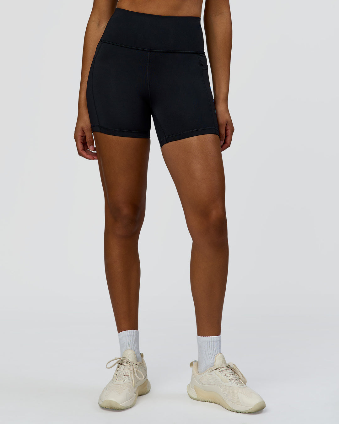 Woman wearing Rep Ultra High-Rise 4" Short Pockets - Black-Palace Blue | Model:Rosie | Size:S