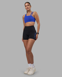 Woman wearing Rep Ultra High-Rise 4" Short Pockets - Black-Power Cobalt | Model:Rhiley | Size:S | Thumbnail Index: 4