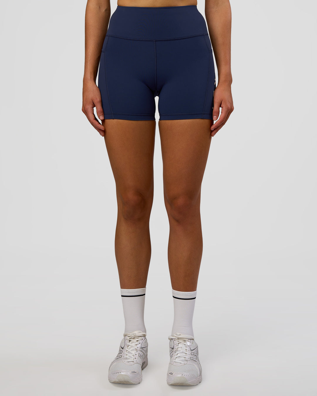 Woman wearing Rep Ultra High-Rise 4" Short Pockets - Future Navy-White | Model:Evie | Size:S