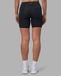 Woman wearing Rep Ultra High-Rise 6" Short Pockets - Black-Blue Atoll | Model:Sophie | Size:S