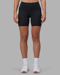 Woman wearing Rep Ultra High-Rise 6" Short Pockets - Black-Blue Atoll | Model:Sophie | Size:S