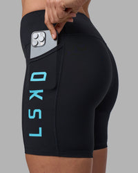 Woman wearing Rep Ultra High-Rise 6" Short Pockets - Black-Blue Atoll | Model:Sophie | Size:S