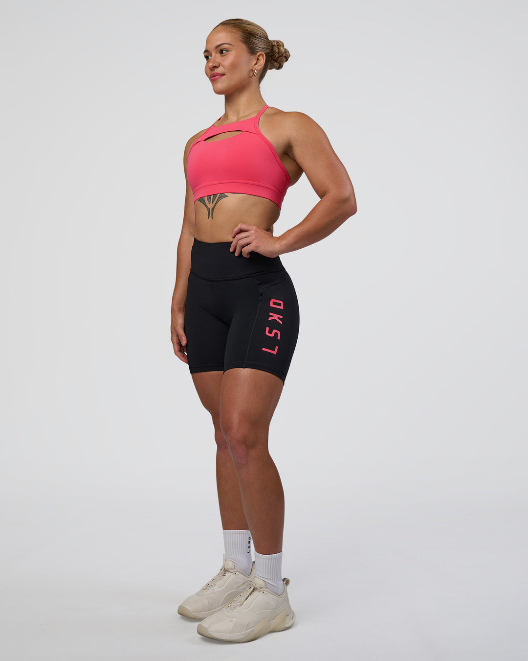 Woman wearing Rep Ultra High-Rise 6" Short Pockets - Black-Bright Raspberry | Model:Tenaya | Size:S