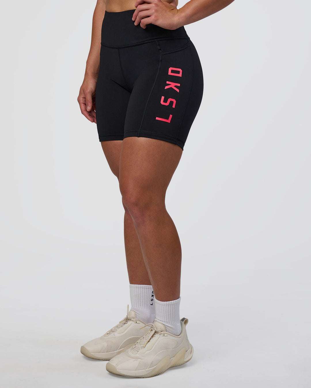 Woman wearing Rep Ultra High-Rise 6" Short Pockets - Black-Bright Raspberry | Model:Tenaya | Size:S