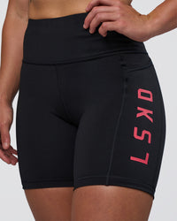 Woman wearing Rep Ultra High-Rise 6" Short Pockets - Black-Bright Raspberry | Model:Tenaya | Size:S