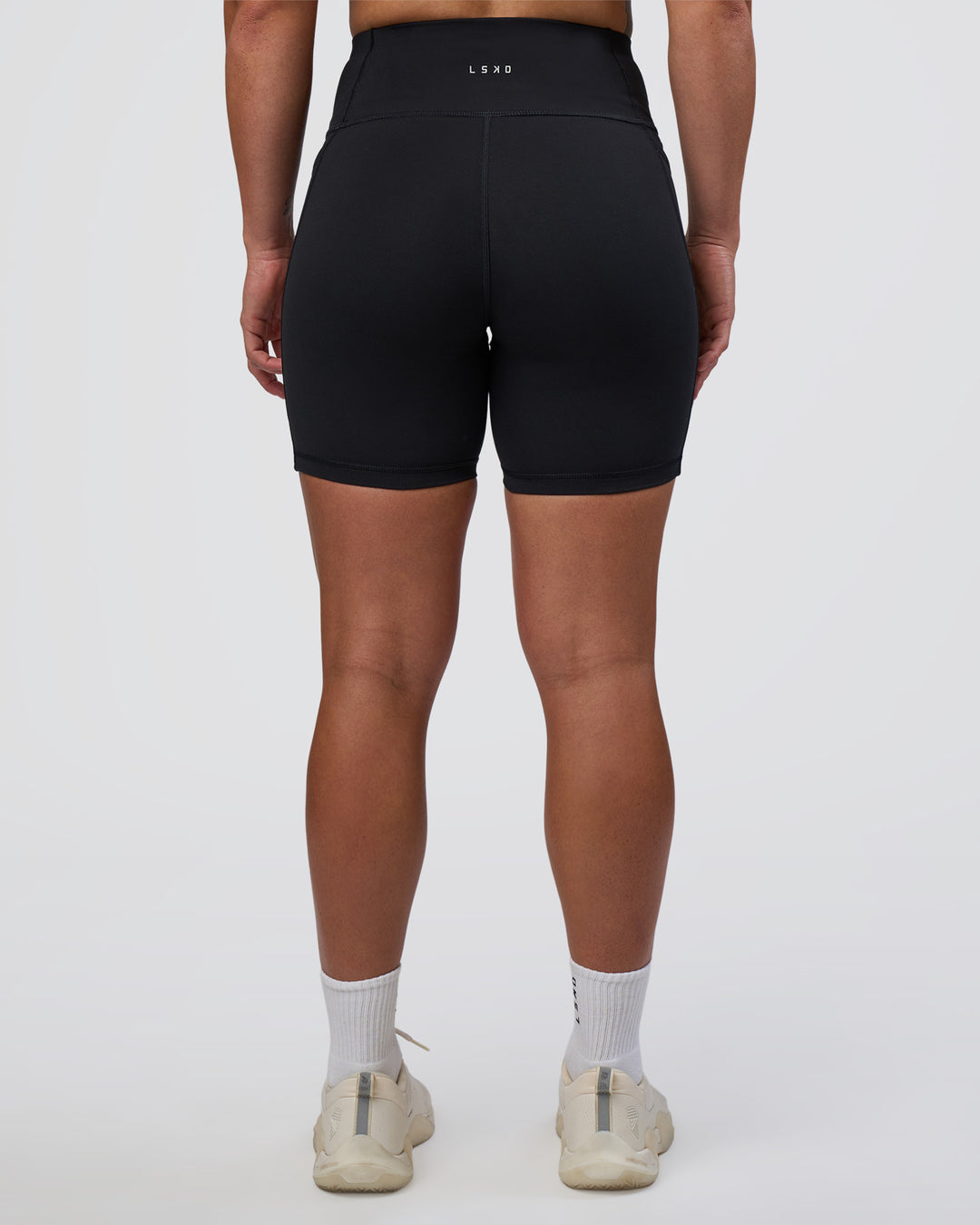 Woman wearing Rep Ultra High-Rise 6" Short Pockets - Black-Bright Raspberry | Model:Tenaya | Size:S