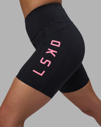 Woman wearing Rep Ultra High-Rise 6" Short Pockets - Black-Candy Pink | Model:Keisha | Size:S