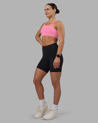 Woman wearing Rep Ultra High-Rise 6" Short Pockets - Black-Candy Pink | Model:Keisha | Size:S