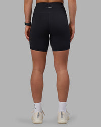 Woman wearing Rep Ultra High-Rise 6" Short Pockets - Black-Candy Pink | Model:Keisha | Size:S