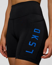 Woman wearing Rep Ultra High-Rise 6" Short Pockets - Black-Electric Indigo | Model:Evie | Size:S