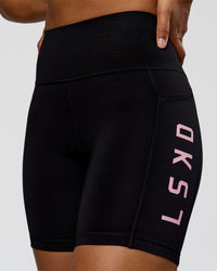 Woman wearing Rep Ultra High-Rise 6" Short Pockets - Black-Marshmallow | Model:Rosie | Size:S