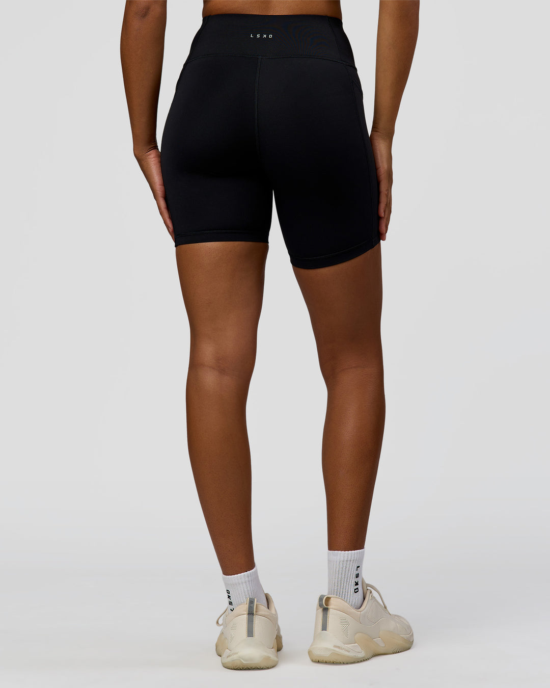 Woman wearing Rep Ultra High-Rise 6" Short Pockets - Black-Marshmallow | Model:Rosie | Size:S